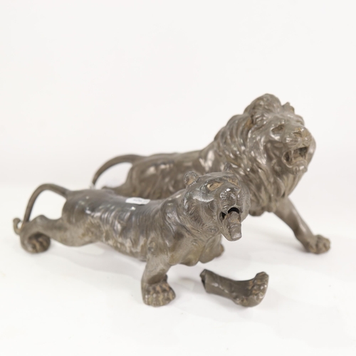 819 - A Chinese spelter lion sculpture, and similar tiger (1 leg detached)