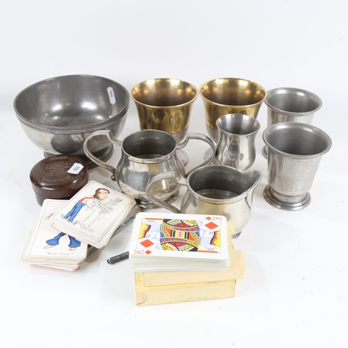 830 - Pewter beakers, gilded pewter goblets with touch marks, playing cards etc