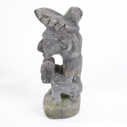 841 - A South American pottery Tribal figure holding a child, height 22cm