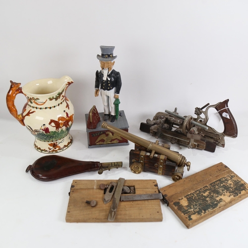 843 - Various collectables, including brass table cannon, leather powder flask, novelty Uncle Sam money ba... 