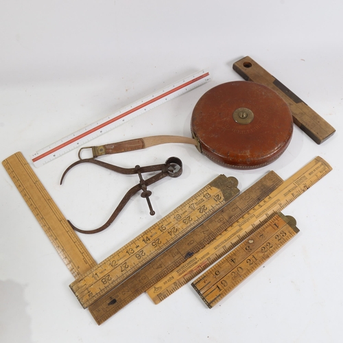 878 - Chesterman leather-cased retractable measuring tape, folding rules etc