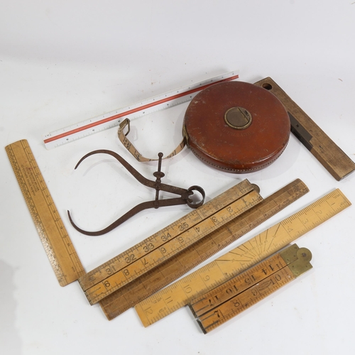 878 - Chesterman leather-cased retractable measuring tape, folding rules etc