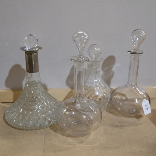 880 - 4 glass decanters and stoppers