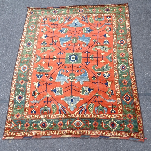 2730 - A red and green ground Afghan carpet, with 3 symmetrical border, 320cm x 254cm. Viewing by appointme... 