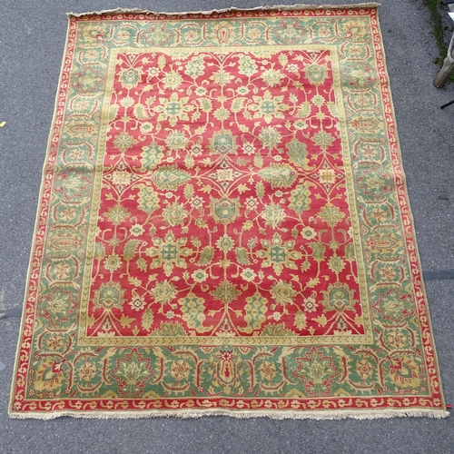 2733 - A cream and red ground Persian design carpet, with symmetrical pattern, 322cm x 254cm. Viewing by ap... 