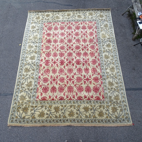 2734 - A cream ground Persian design carpet, with gold and red symmetrical floral pattern, 360cm x 270cm. V... 