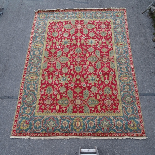 2735 - A red ground Persian design carpet, floral symmetrical decoration, 365cm x 276cm. Viewing by appoint... 