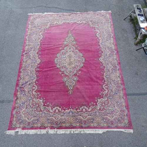 2736 - A red ground Persian design carpet, with floral embossed decoration, 370cm x 274cm. Viewing by appoi... 