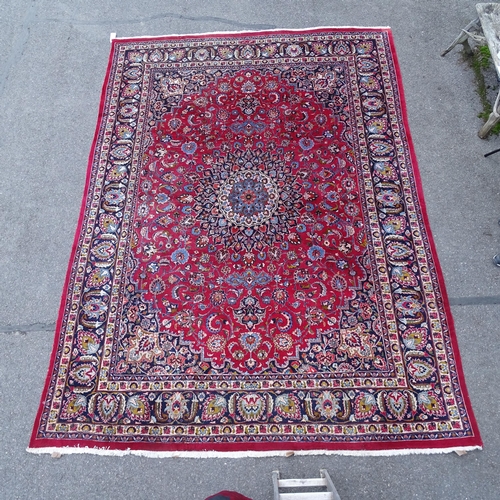 2737 - A red ground Persian design Mashad carpet, 395cm x 285cm. Viewing by appointment.