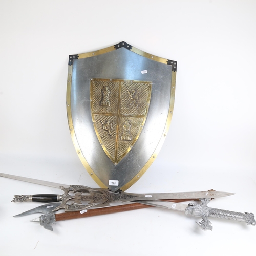 903 - A reproduction steel and brass-mounted shield, 2 reproduction swords, and an axe (for display purpos... 