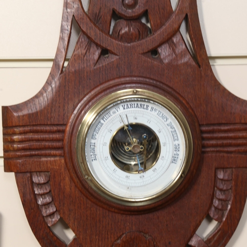 918 - An Art Nouveau oak aneroid barometer, length 68cm