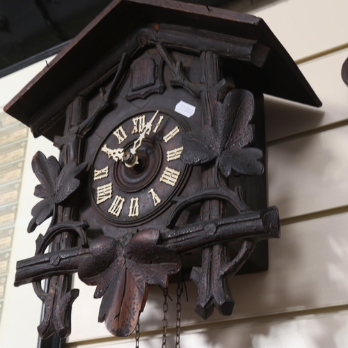 919 - A Black Forest 30 hour cuckoo clock, complete with weights and pendulum