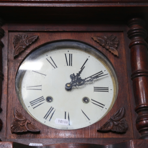 921 - A 1920s oak-cased 8-day wall clock, with pendulum, length 95cm, working order