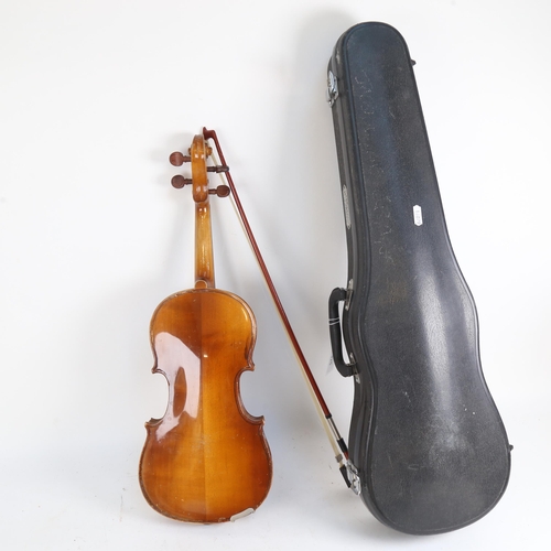 925 - A half-size violin and bow, in hardshell case