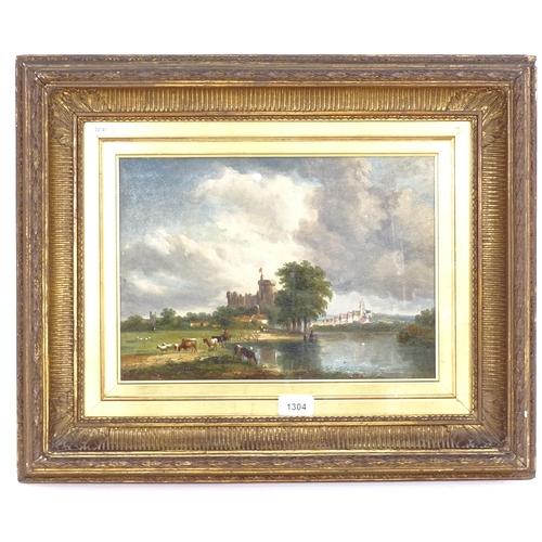 1304 - A 19th century oil on canvas, castle and grazing cattle by a river, in a giltwood and gesso frame, o... 