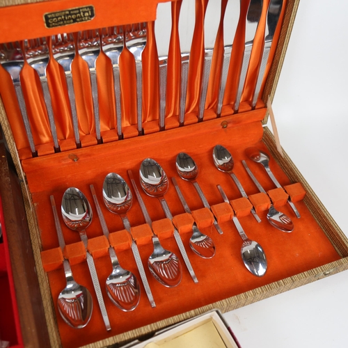 1111 - A canteen of stainless steel cutlery, teak-cased, and another, and 3 other cased sets of plated cutl... 