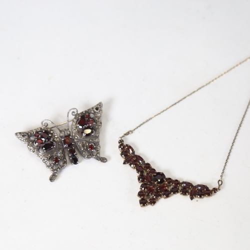 1238 - A garnet set necklace, and a silver and garnet set butterfly design brooch