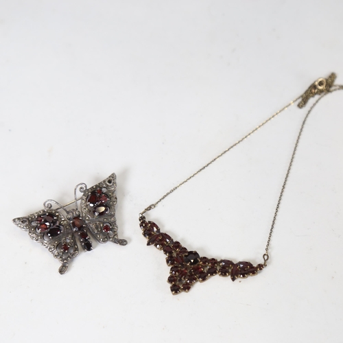 1238 - A garnet set necklace, and a silver and garnet set butterfly design brooch