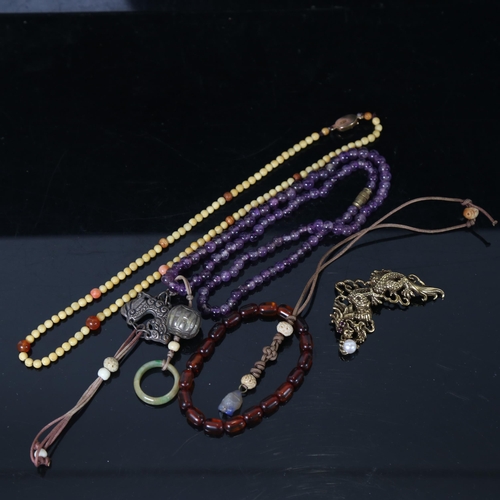 1255 - Various bead necklaces, amber bracelet, and a Franklin Mint sterling silver-gilt Year Of The Dragon ... 