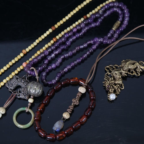 1255 - Various bead necklaces, amber bracelet, and a Franklin Mint sterling silver-gilt Year Of The Dragon ... 