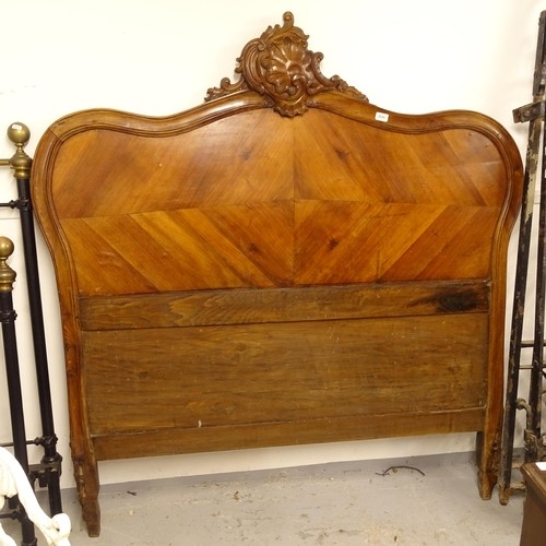 2702 - A 19th century French walnut bed-head, with carved pediment