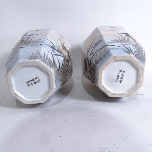 203 - A pair of Japanese hand painted porcelain octagonal vases, height 36cm