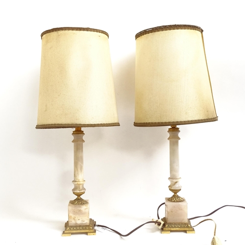 215 - A pair of Regency style white onyx and ormolu column table lamps and shades, height 48cm