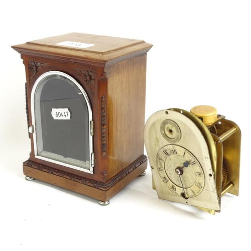 378 - A small mahogany-cased mantel clock, with loose movement