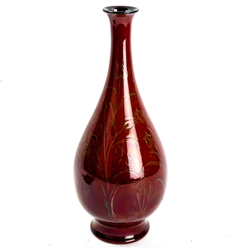 1006 - Pilkington's Royal Lancastrian dark red glaze pottery narrow-neck vase, with incised floral decorati... 