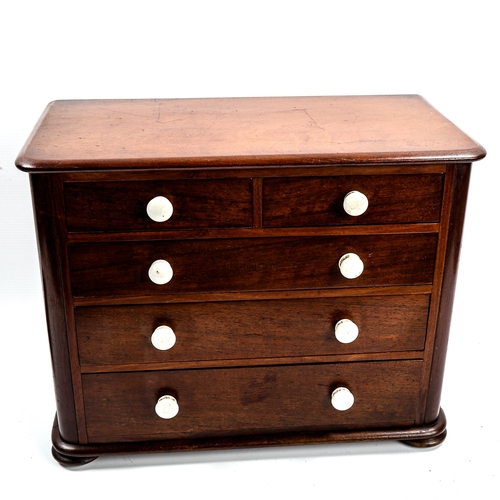 1031 - A Victorian mahogany apprentice chest of drawers, with ceramic handles and bun feet, width 38cm, hei... 