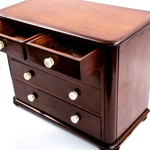 1031 - A Victorian mahogany apprentice chest of drawers, with ceramic handles and bun feet, width 38cm, hei... 