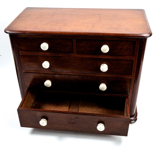 1031 - A Victorian mahogany apprentice chest of drawers, with ceramic handles and bun feet, width 38cm, hei... 