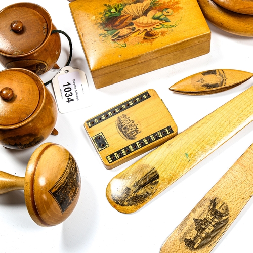 1034 - A collection of Victorian Mauchline Ware boxes and treen, including a pair of paper knives, a pair o... 