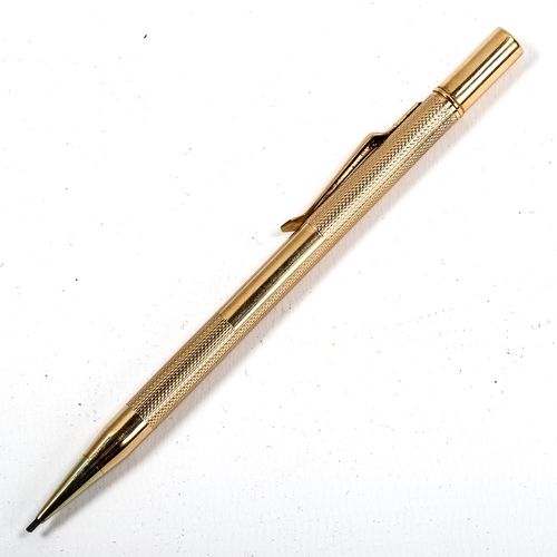 1038 - A 9ct gold propelling pencil, by Carrington & Co, hallmarks Birmingham 1934, boxed