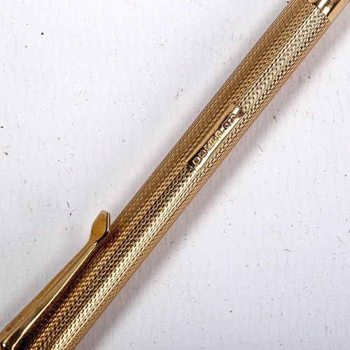 1038 - A 9ct gold propelling pencil, by Carrington & Co, hallmarks Birmingham 1934, boxed