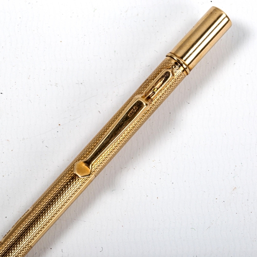 1038 - A 9ct gold propelling pencil, by Carrington & Co, hallmarks Birmingham 1934, boxed