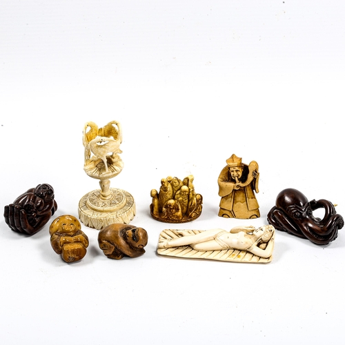 1049 - A group of Oriental ivory and wood netsuke, and an ivory stork design stand (8)