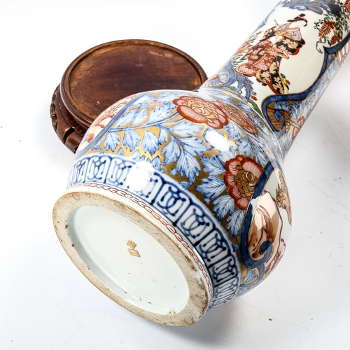 1055 - A Chinese 19th century porcelain sleeve vase, with hand painted and gilded decoration, on original h... 