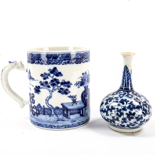 1067 - A large Chinese blue and white porcelain tankard with dragon handle, height 13cm, rim diameter 11cm,... 