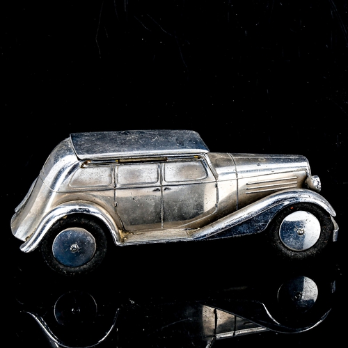 1087 - Art Deco chrome plate deskstand, in the form of a saloon car, with hinged roof and pen holder on the... 