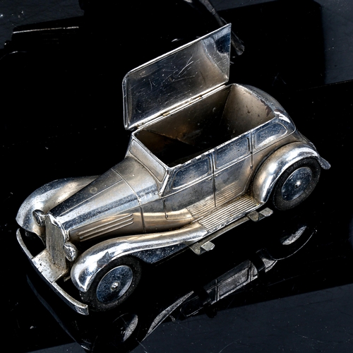 1087 - Art Deco chrome plate deskstand, in the form of a saloon car, with hinged roof and pen holder on the... 