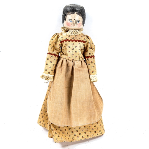 1091 - A Vintage hand painted wood peg doll, with original clothes, length 30cm