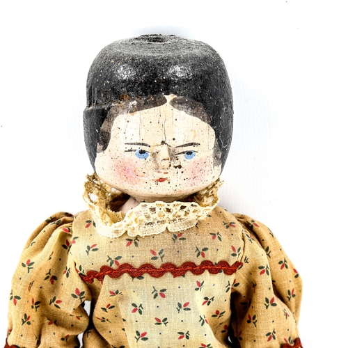 1091 - A Vintage hand painted wood peg doll, with original clothes, length 30cm