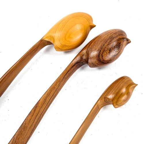 1097 - A set of 3 carved wood long-tailed birds with matching perches, carved by John Fox, longest 25.5cm