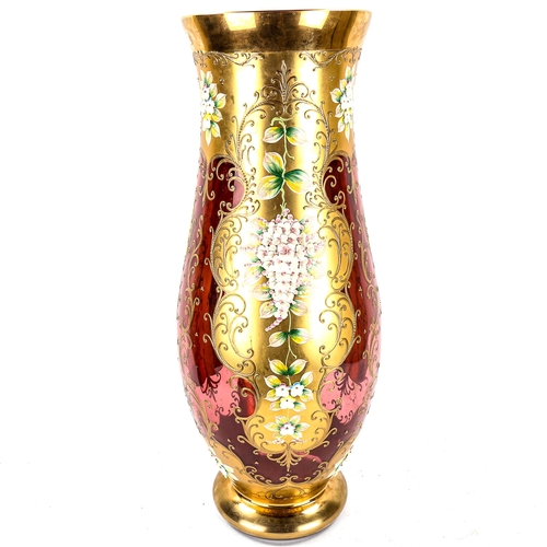 1099 - A large Venetian gilded cranberry glass vase, with relief moulded applied flowers, height 60cm