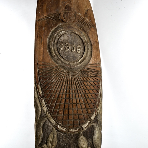 1102 - A Great War Period laminate wood aircraft propeller, with all over relief carved decoration, dated 1... 