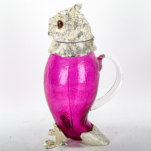 1112 - A ruby flash glass and electroplate owl design Claret jug, height 29cm