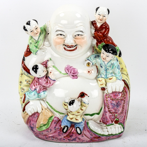 1117 - A Chinese porcelain Buddha with children, height 26cm