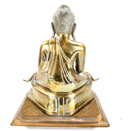 1119 - A Chinese polished bronze seated Buddha on wood plinth, height 38cm