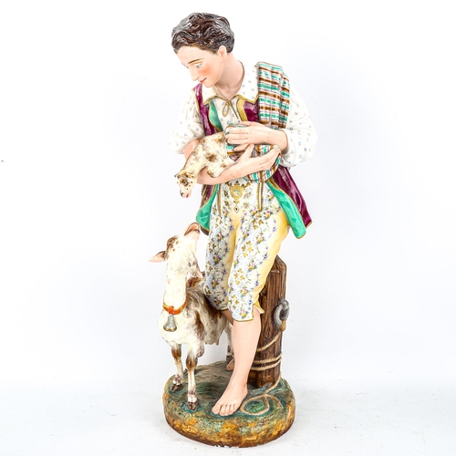 1127 - A 19th century Continental porcelain figure of a boy with a goat and kid, no factory marks, height 4... 
